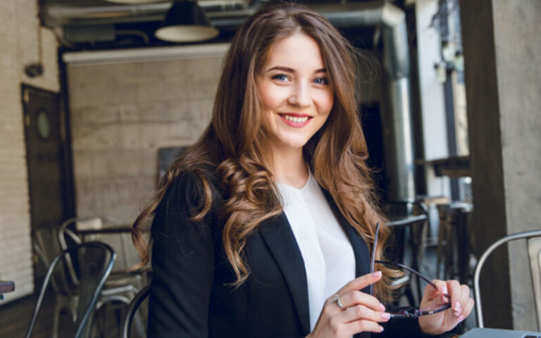 pretty girl sitting at office desk